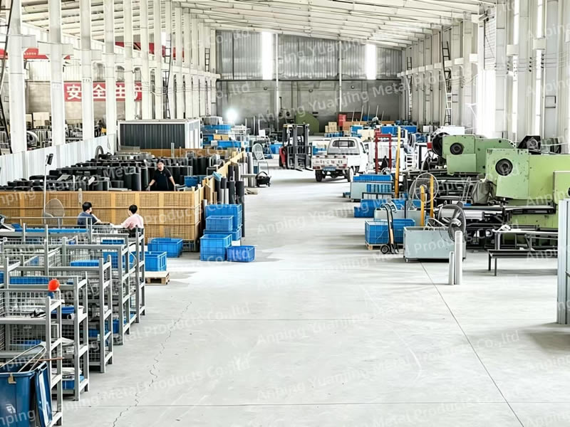 Wide view of the metal mesh production workshop with industrial machinery