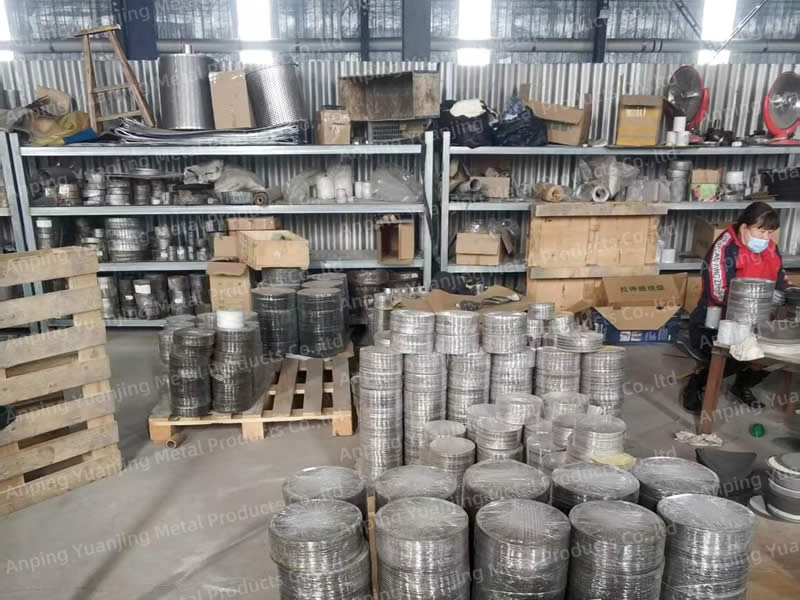 Stainless steel filter discs stacked in the filter processing workshop