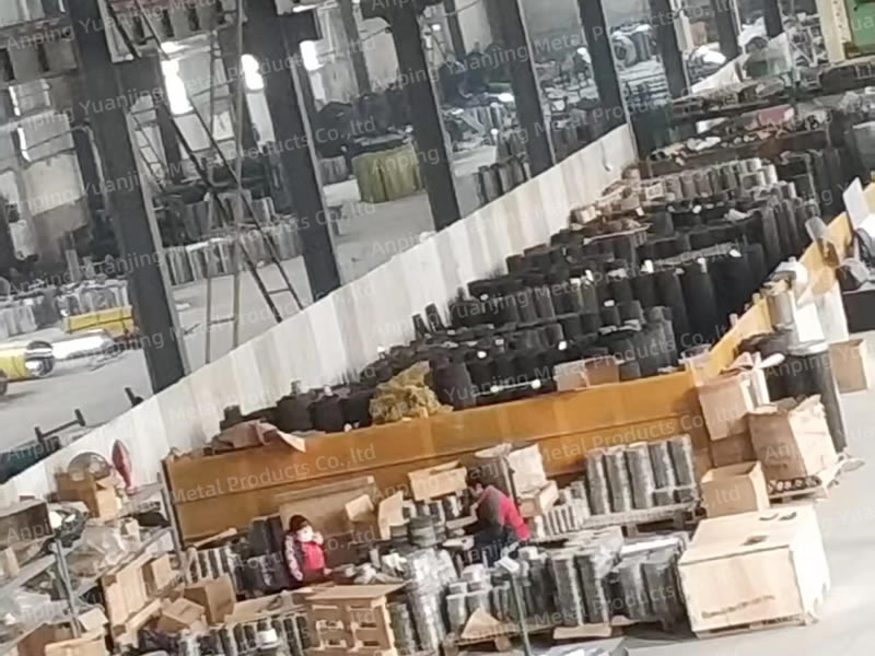 Metal wire mesh rolls organized in the factory storage and packing area